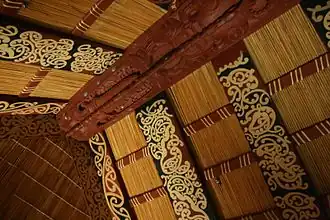 The ridgepole (tāhuhu) and perpendicular rafters (heke) from inside