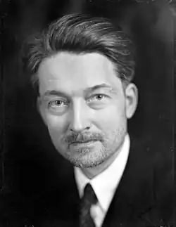 A black-and-white head shot of Maritain looking toward the camera