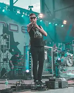 Dutton performing with Hinder in July 2024.