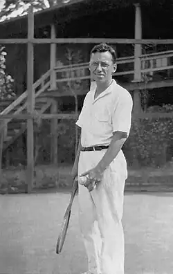 Set to serve. Playing tennis while on vacation