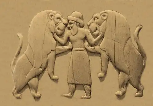 Master of animals, wearing a long skirt and trousers, as well as a brimmed hat (Back, 1st register).[33][34][35]