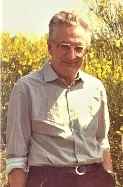 A middle-aged man stood in scrubland