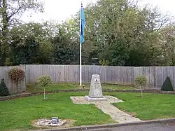 A memorial to the No. 11 Group underground operations room alongside the RAF ensign at RAF Uxbridge.