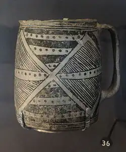 A color picture of a black-on-white pottery vessel