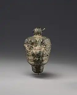 This bronze pendant features a suspension loop to ensure that the demon's gaze is always directed outward; for example, with the demon's apotropaic power directed, not at the amulet's owner, but at the owner's supernatural enemies.[16]