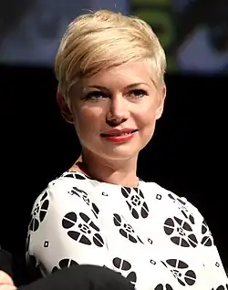 Michelle Williams is gently smiling for the camera.