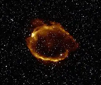 Composite image using X-ray light from Chandra (orange) that has been overlaid on an infrared image from 2MASS.[13]