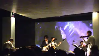 Atwood-Ferguson (right) performing with the Miguel Atwood-Ferguson Ensemble in Los Angeles in 2014