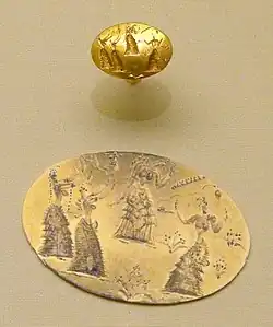 Gold ring & blow-up. Four women with similar dress. The wavy line about the woman at far right has been called a snake.