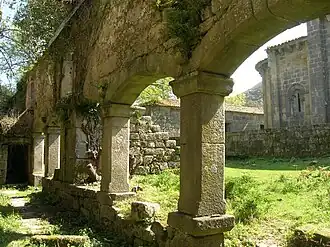 Ruined cloister of Sanfins de Friestas Church, with short arcades.