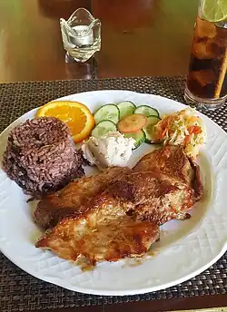 Moros y cristianos served with pork, at a restaurant in Cienfuegos, Cuba.