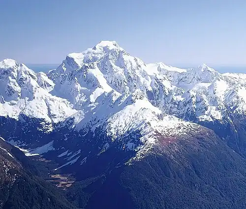 Aerial view of Mount Madeline in front of Mount Tūtoko, lined up together from southeast.