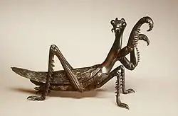 Murata Seimin (1761–1837), Brush rest in the shape of a praying mantis, circa 1800 (late Edo), Medium: bronze, Dimensions: 18 cm (7 in), Japan. Collected By the Walters Art Museum.