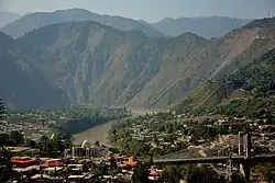 Heightened view of the city on both riverbanks after the 2005 Kashmir earthquake,  2014