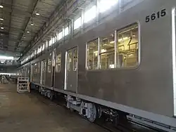 Withdrawn 5000 series cars at the Osaka Sharyo plant in August 2014 undergoing modifications ahead of shipment to Argentina