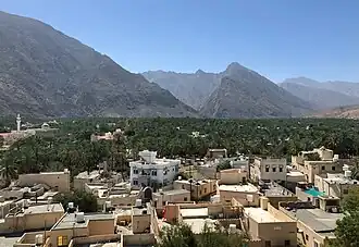 View of the town from Nakhal Fort, with Al Hajar Mountains in the background