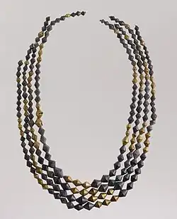 Sumerian necklace beads; 2600–2500 BC; gold and lapis lazuli; length: 54 cm (21 in); Metropolitan Museum of Art (New York City)