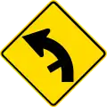Curve between 15 and 90 degrees with minor road, to left