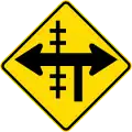 Railway level crossing on controlled T-junction to left