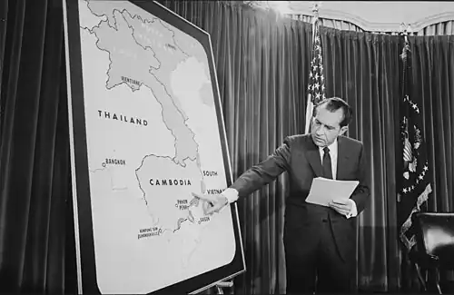 Richard Nixon pointing at a map of Cambodia