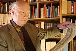 Prof. Nigel F. Palmer, Emeritus Professor of German Medieval and Linguistic Studies, preparing for a lecture series on Easter Plays in Azerbaijan 2015 by examining the facsimile scroll of the Osterspiel von Muri in the Taylor Institution Library, University of Oxford