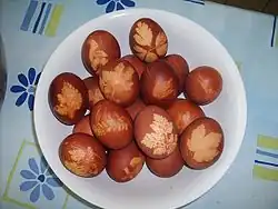 Pace eggs boiled with onion skins and leaf patterns.