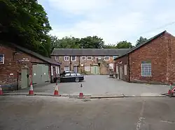Darley Abbey Mills (north complex) preparation building and cottage and workshop and cart sheds to north of site