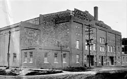 Black and white photo of rink's brick exterior