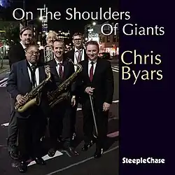Album cover of On the Shoulders of Giants, featuring the musicians on the album standing outside at night in New York City
