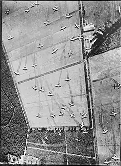 Aerial view of fields covered in abandoned gliders