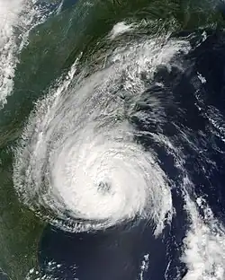 Satellite image of a tropical cyclone near the United States east coast. It presents a pronounced eye feature.