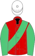 Red, emerald green sash and sleeves, white cap