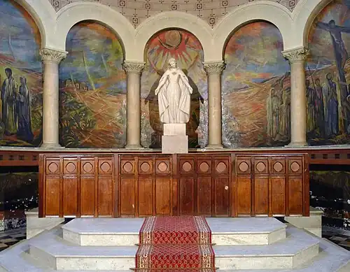 Statue of the Virgin Mary by Henri-Albert-Marie Lagriffoul, in the Choir in front of the "Crucifixion" fresco