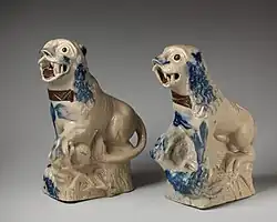 Early pair, c. 1750, copying Chinese figures. salt-glazed stoneware, c. 8.5 inches tall