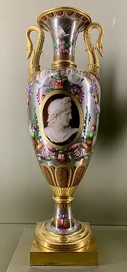 Empire style – Vase, by the Sèvres porcelain factory, 1814, hard-paste porcelain with platinum background and gilt bronze mounts, Louvre[48]