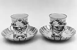 Pair, silver-gilt stands by Paul de Lamerie, London, cups by Doccia porcelain, Florence