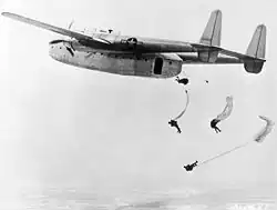 C-82 Packet dropping U.S. Air Force paratroops in training exercise