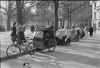 The pedi-cab, or bicycle taxi, was still in use in the spring of 1945 (Imperial War Museums, U.K.)