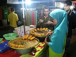 Vendor selling rissole at the pasar malam (night market) in Rawasari, Jakarta