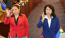 Senators Patricia Gómez and Mirtha Arce make a sign of the cross with their right hands as they are sworn into the Senate Ethics Commission.
