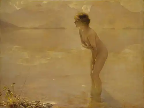 A nude woman standing on a beach