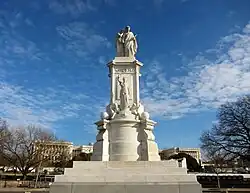 The monument, as seen from its base. Two statues sit atop of it.