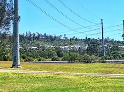 The bushland and pipeline at Hyland Road Park/Reserve with Pemulwuy residential zone in background