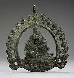 Pendant probably with Siddha; 8th–9th century; copper alloy; 8.89 by 7.93 by 0.31 centimetres (3.50&nbsp;in ×&nbsp;3.12&nbsp;in ×&nbsp;0.12&nbsp;in); Los Angeles County Museum of Art (Los Angeles)