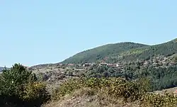 Curving mountain/hill landscape with a detailess sky