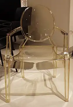 Louis Ghost, a simplified reinterpretation of armchairs in the Louis XVI style; by Philippe Starck; 2009; polycarbonate; height: 94 cm; various locations[138]