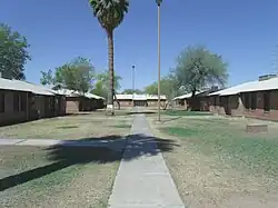 The only remaining courtyard of the Matthew Henson Public Housing Project with the original houses which have been preserved from demolition. The housing project was built in 1940 and provided affordable housing for the African-American community. The Matthew Henson Public Housing Project district is located on the west side of Seventh Avenue just south of the Sherman Street alignment. It was named as a historic district by the Phoenix Historic Property Register in June 2005.