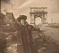 Photograph of Susan Watkins at the Arch of Titus in Rome, ca. 1896-1908 from the Jean Outland Chrysler Library