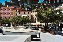 Piazza della Libera featuring dry docked boats