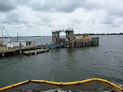 A ferry pier jutting into the water from the left-hand side of the image